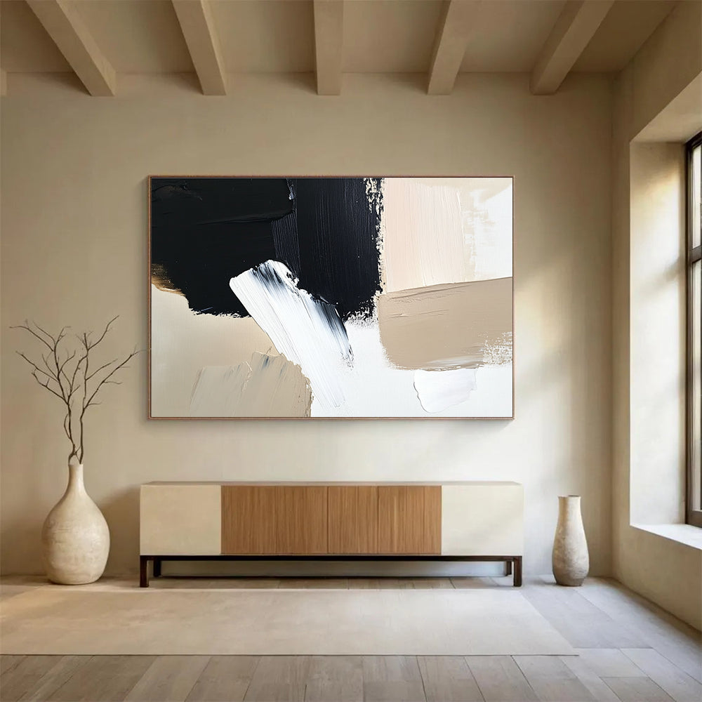 Large abstract painting featuring black brush strokes on a white background complemented by a minimalist beige and cream color palette.SC012