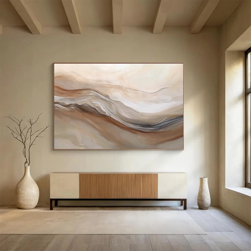 Large abstract painting featuring swirling beige and white hues resembling desert dunes capturing movement and depth in a serene landscape.SC447