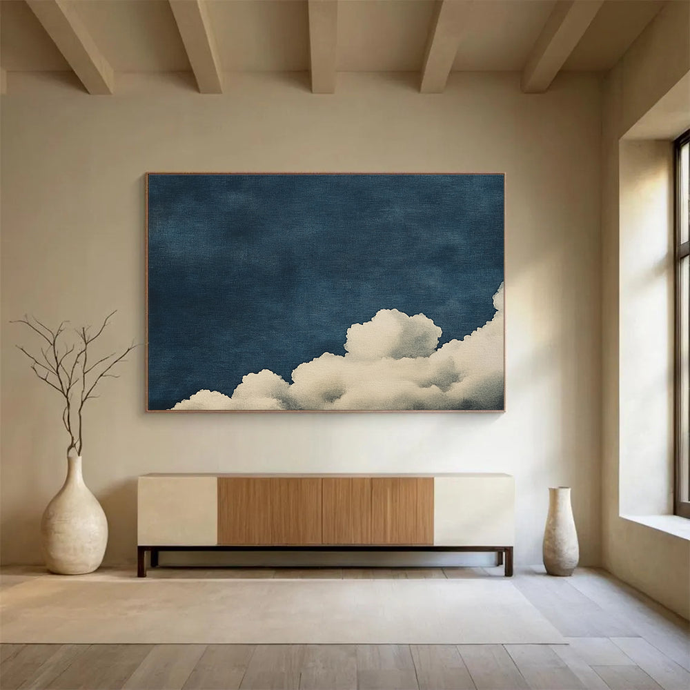 Large abstract painting of clouds on textured canvas featuring high contrast white clouds against a minimalist dark blue background.SC523