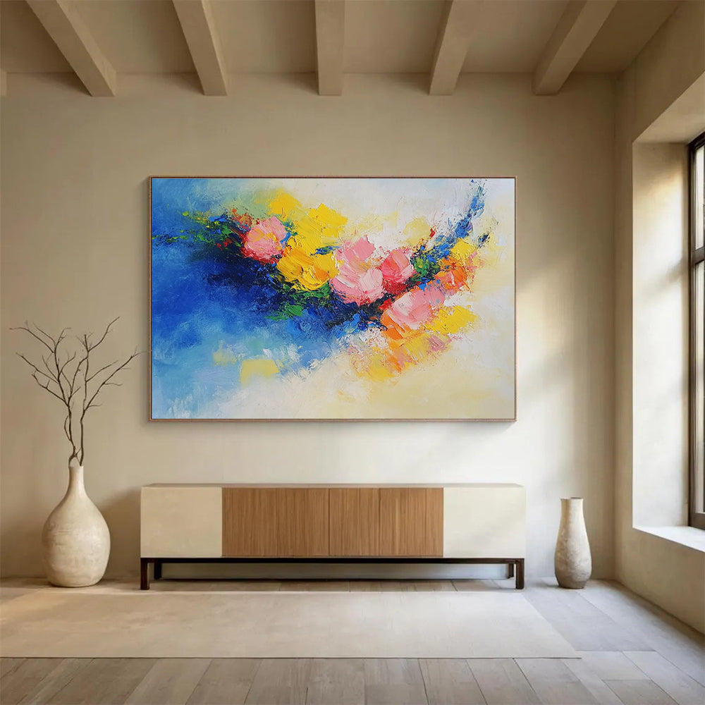Large abstract painting of flowers in vibrant yellow, blue, and pink featuring textured palette knife techniques. Perfect for modern decor.SC190