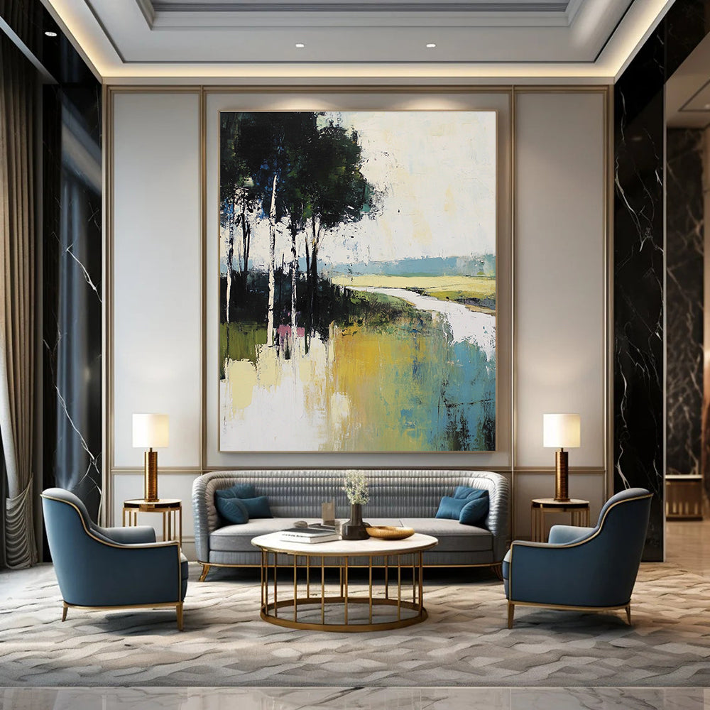 Large abstract painting featuring muted greens blues and whites depicting tranquil nature with tall trees and a serene river flowing through grassy fields.STSC100