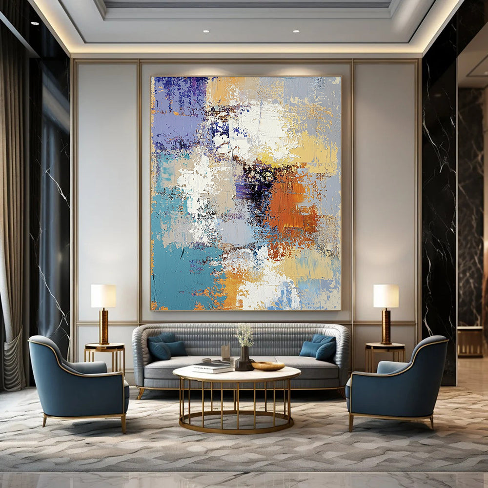 Large abstract oil painting featuring textured layers of blue yellow white gray beige and brown with intricate patterns and emotional depth.STSC584