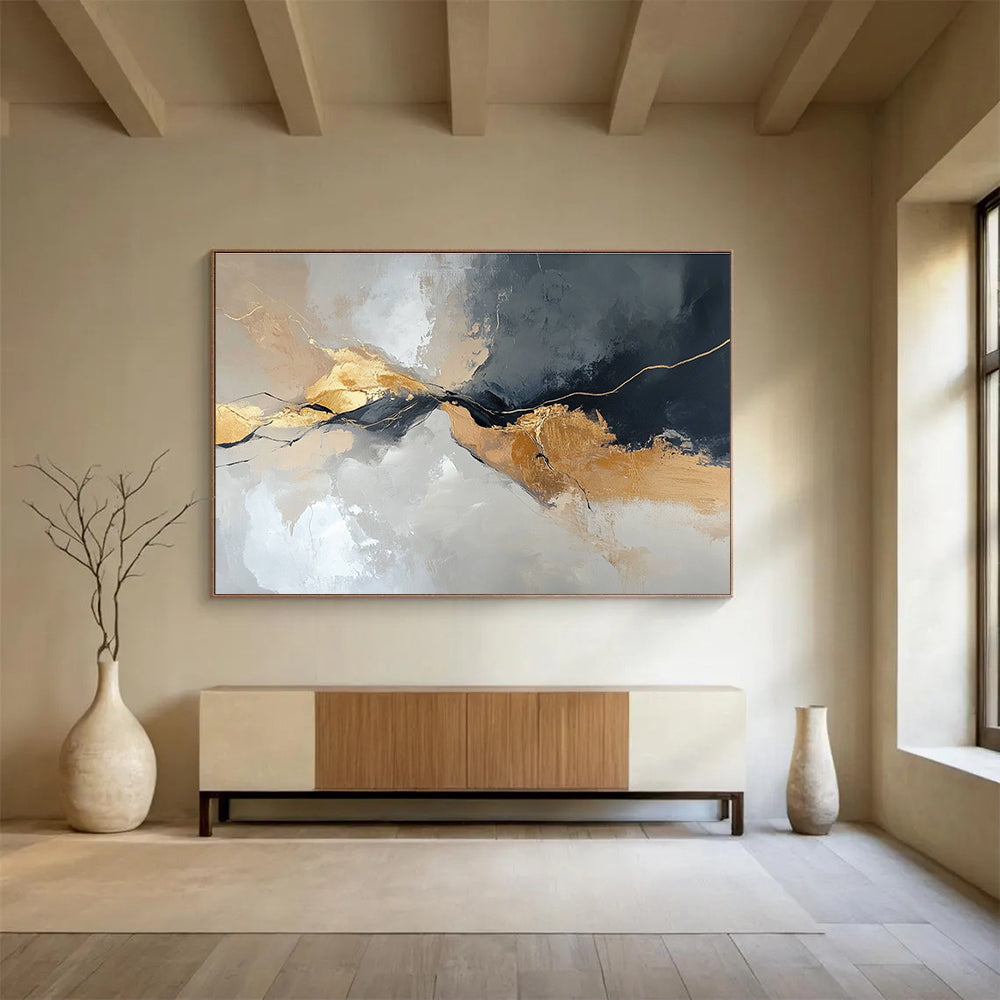 Large abstract painting with an aerial view in gray and beige colors featuring minimalistic shapes and brush strokes enhanced with gold accents.SC104