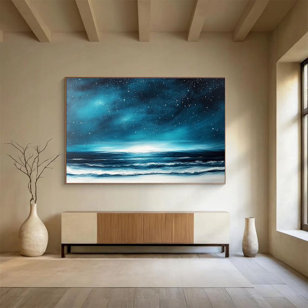 A large abstract painting featuring a dark blue sky with stars and ocean waves, accented with white and light teal hues.SC396