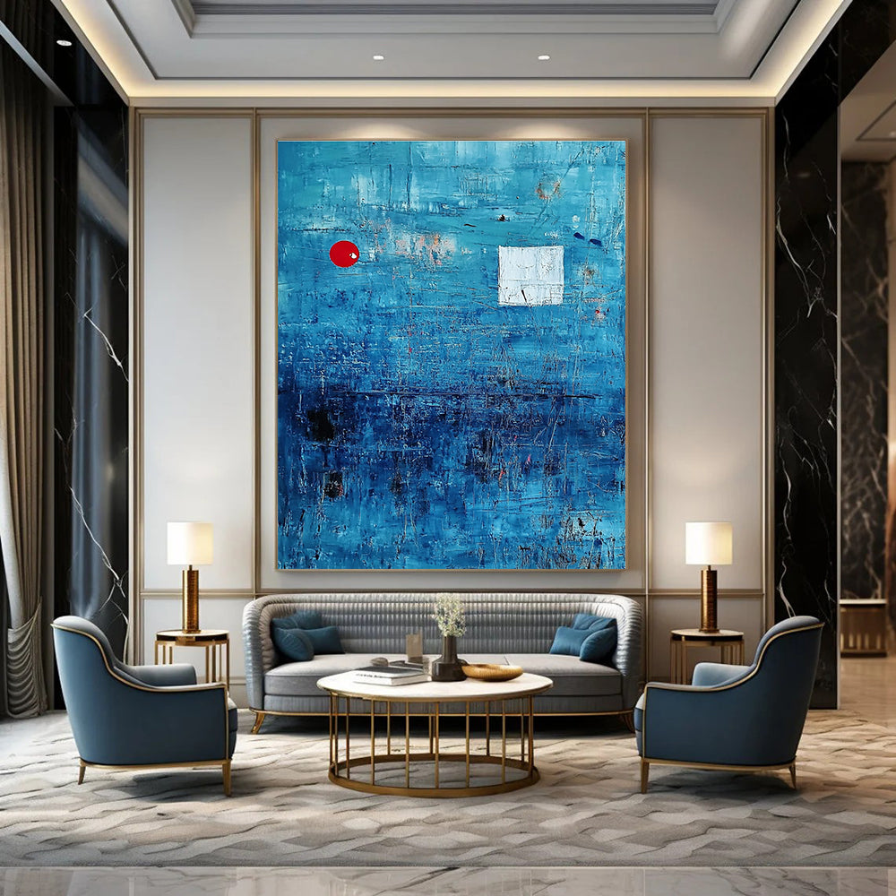 Large abstract painting featuring a serene blue ocean with textured brush strokes and dynamic black lines, accented by a small red circle and white squares.STSC041