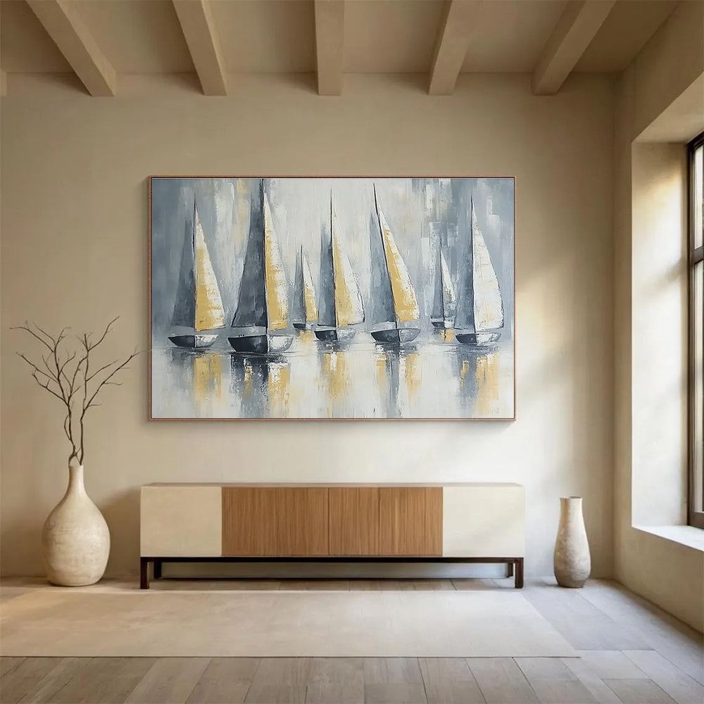 Large abstract painting featuring sailing boats with gray and gold sails on calm waters under soft lighting and a neutral background.SC610