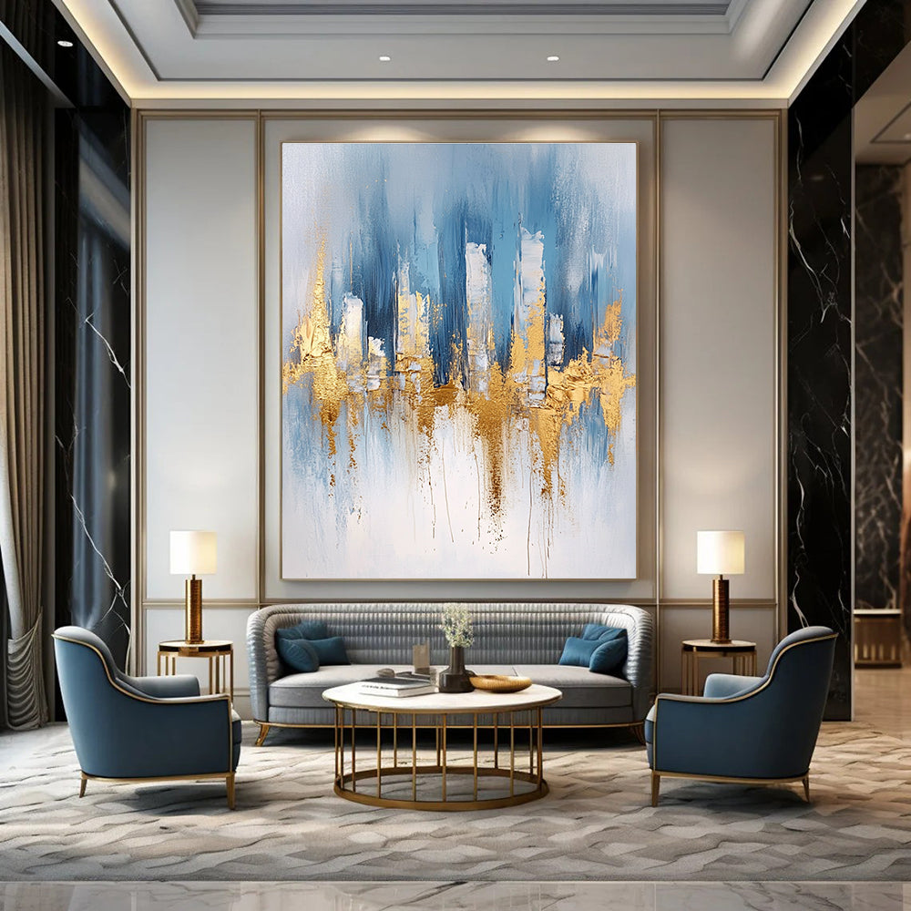 Large abstract blue and gold painting with urban landscape details light gray brushstrokes and elegant gold foil accents on canvas edges.STSC033