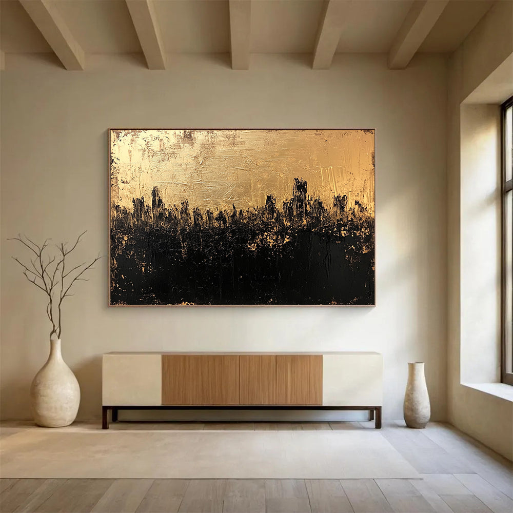 Large abstract painting in gold and black featuring a textured surface that captures a dark cityscape with an atmospheric moody quality.SC143