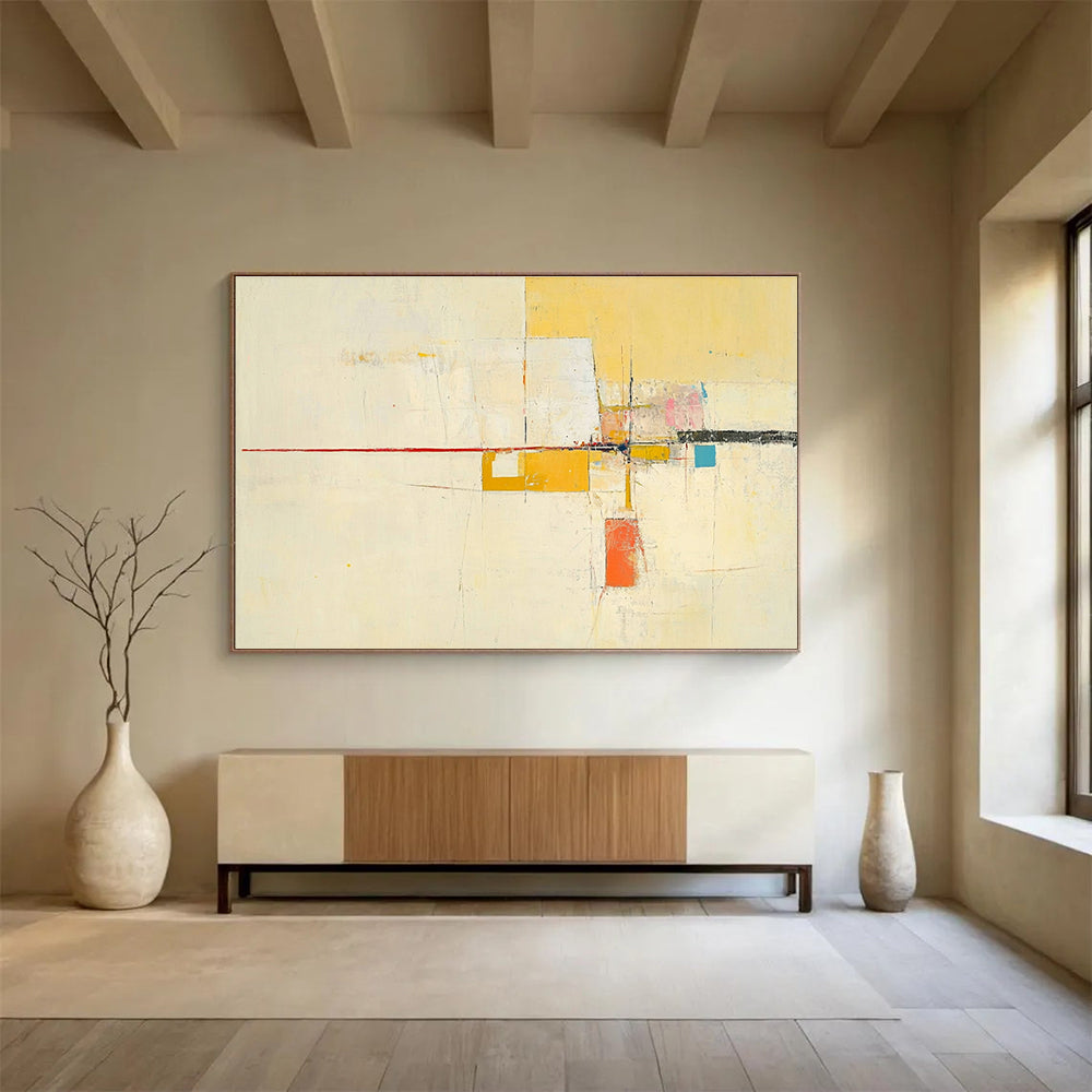 Large abstract painting featuring yellow beige colors thin red line off-white background small blue square soft orange lines geometric shapes and ample white space.SC332
