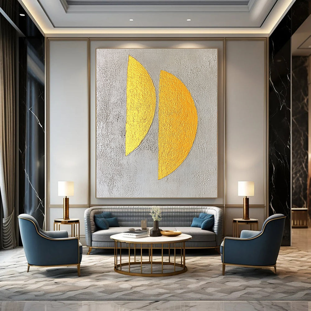 Large abstract painting featuring two yellow semicircles on a textured grey background with gold leaf highlights in a minimalist style.STSC356