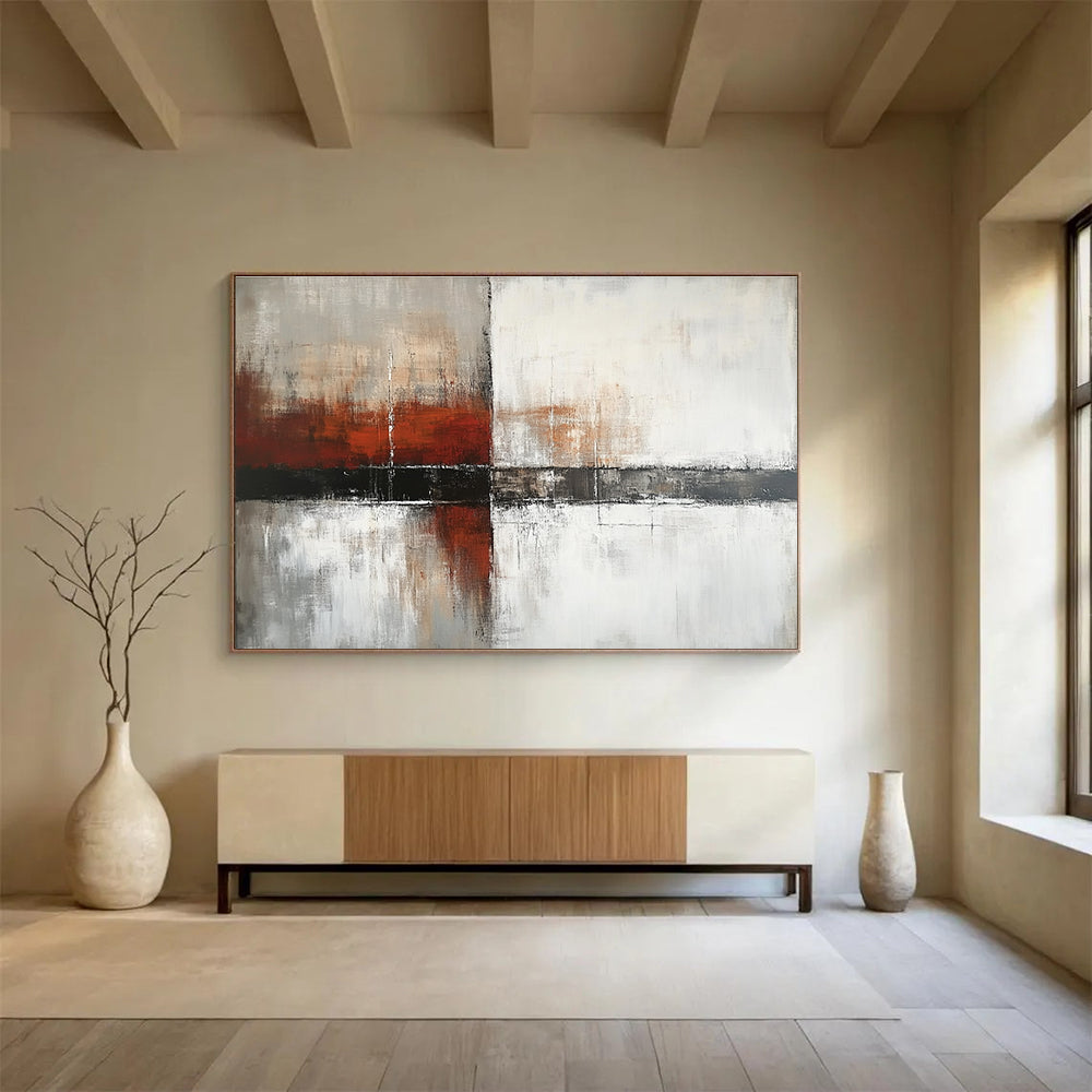 Large abstract painting with a calming color palette of white gray and soft tones featuring dark red orange brushstrokes and textured layers.SC592