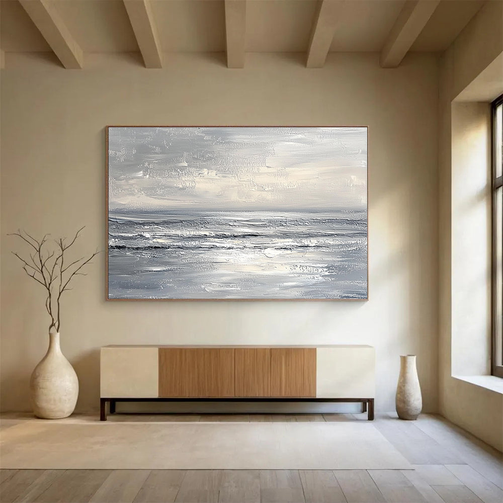 Abstract seascape in impasto oil, featuring textured strokes in muted whites and greys, capturing a minimalist beach with soft waves and sky.SC276