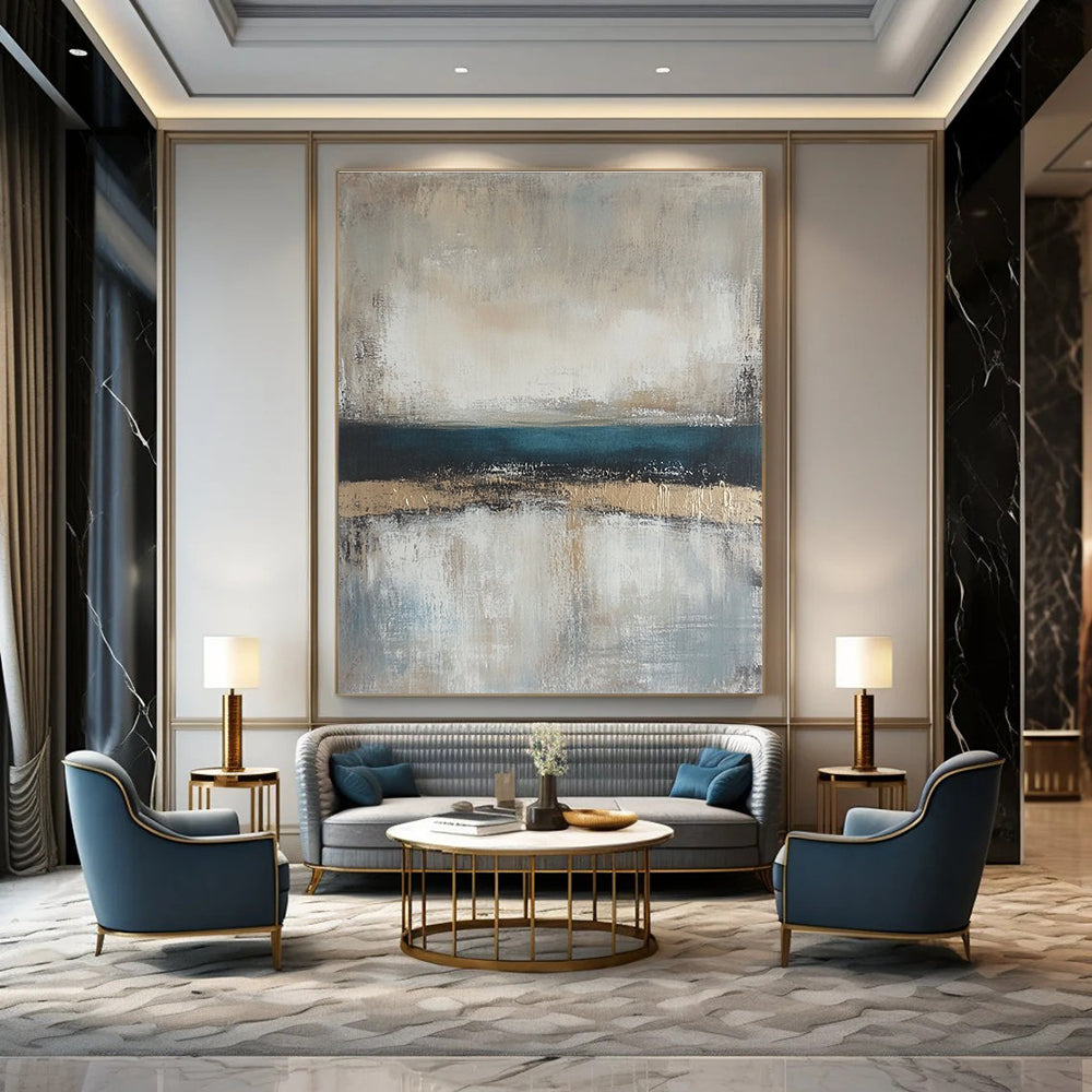 Large abstract painting featuring neutral colors and soft tones of beige gray and blue with a serene horizon line.STSC462