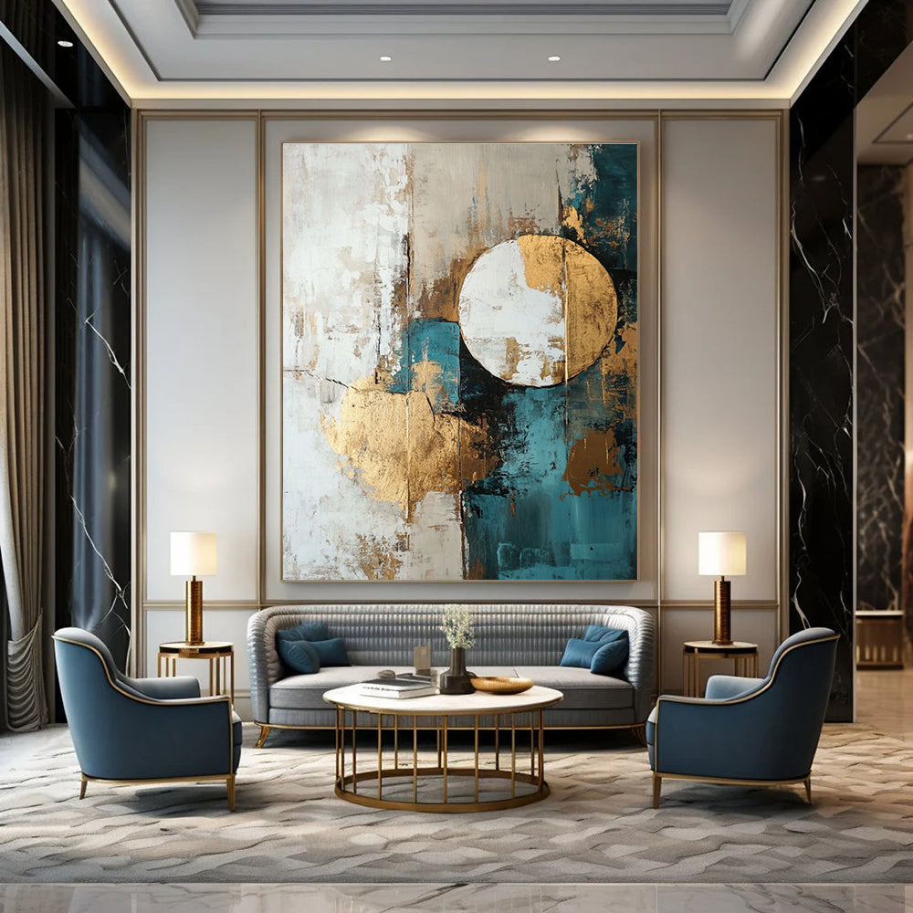 Large abstract painting featuring shapes and lines in white beige teal blue and brown with gold foil accents.STSC193