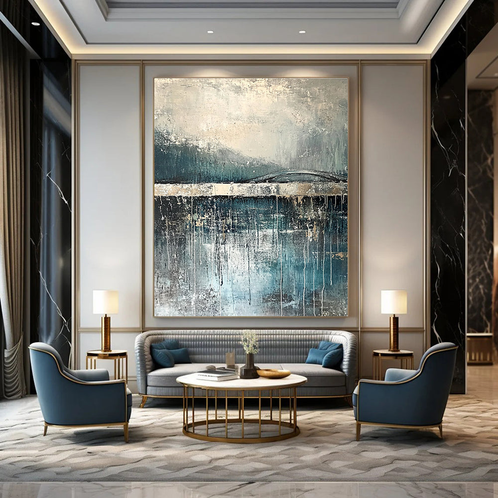 Large abstract painting depicting rain reflections on water with an old bridge in gray and blue tones accented with silver on textured canvas.STSC326