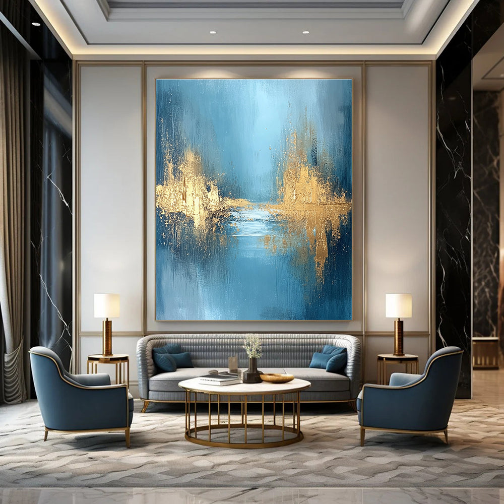 Large abstract painting featuring textured golden water and a misty morning atmosphere with blue grey and white hues for a serene mood.STSC723