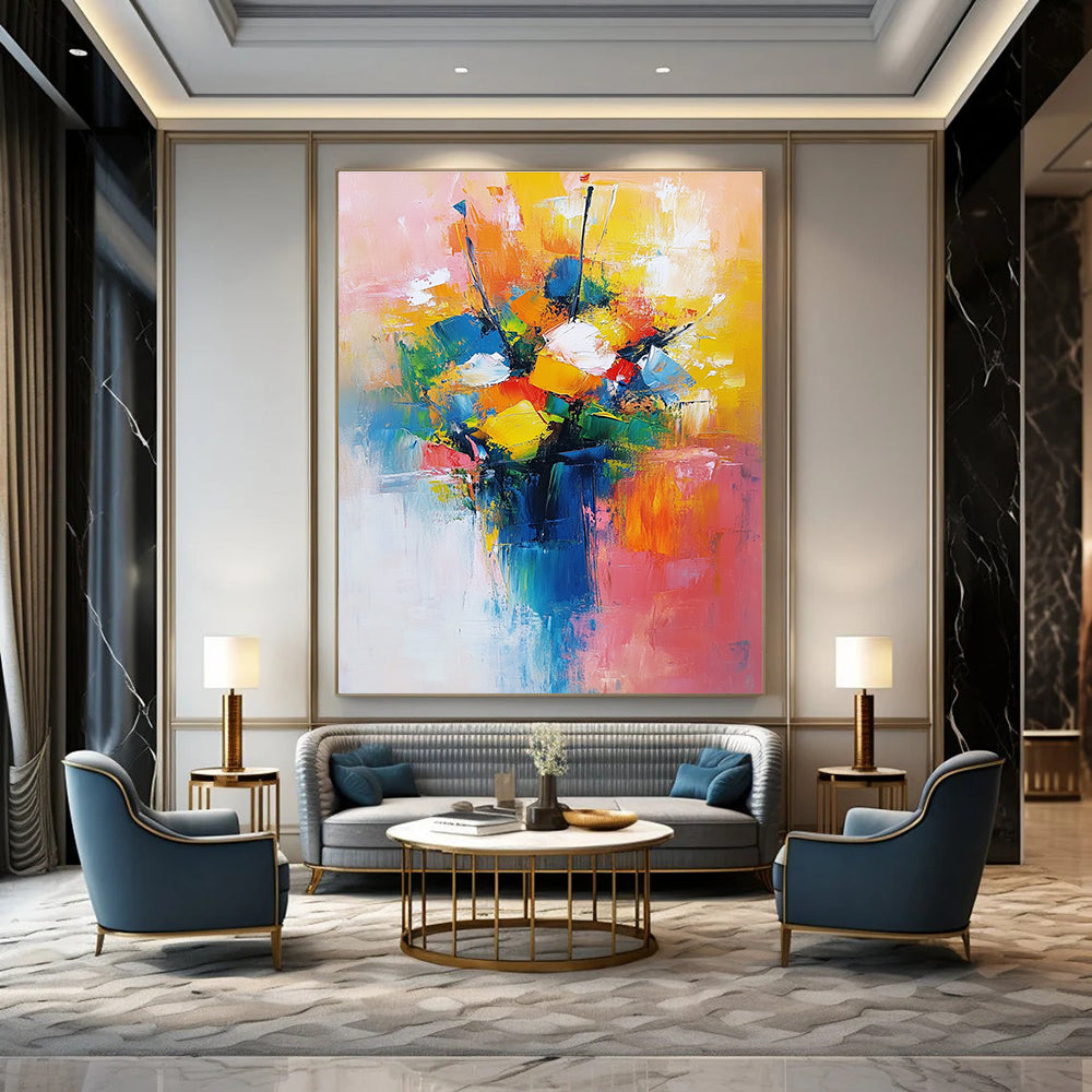 Large abstract painting featuring a vibrant bouquet in yellow blue and red with a light pink orange background conveying joy and calmness.STSC251