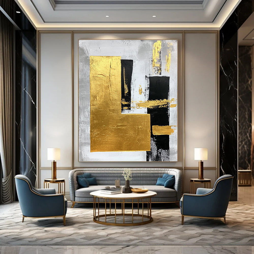 Large abstract art painting featuring gold foil bold strokes and minimalist black lines on a gray background creating an elegant atmosphere.STSC015