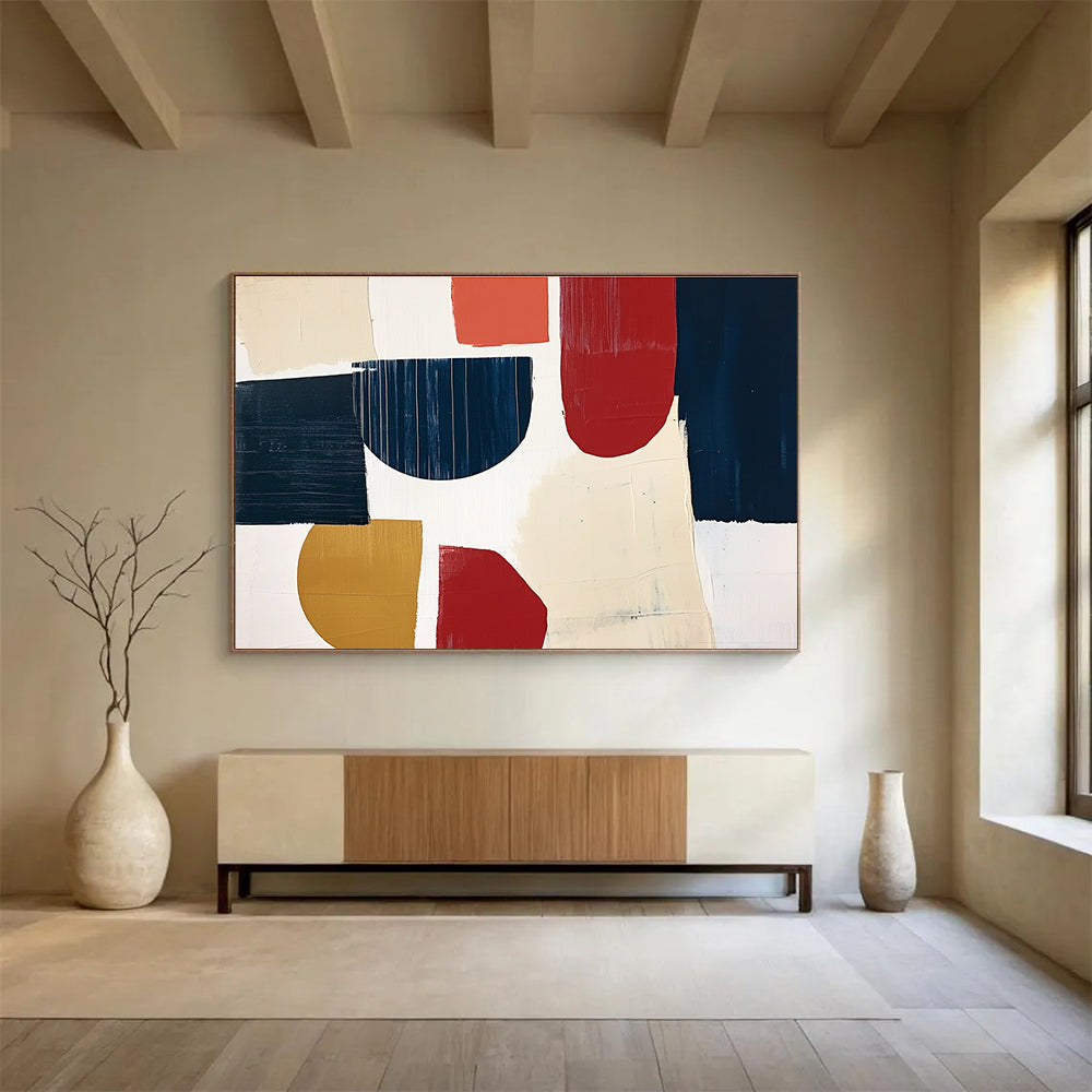 A large abstract painting featuring navy blue cream and red shapes with loose brush strokes on a white background in a collage style.SC489