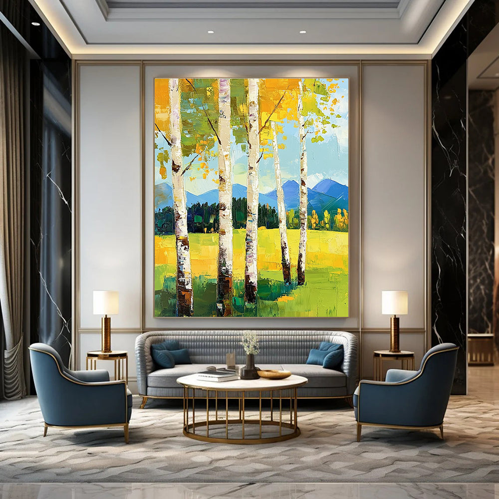 Large abstract painting featuring birch trees in spring vibrant greens and yellows with mountains in the background and thick expressive brush strokes.STSC871