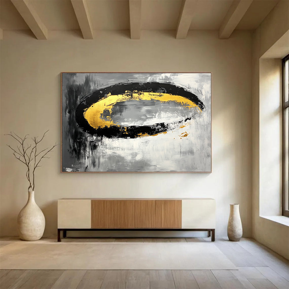Large abstract painting featuring black white gray tones with gold accents and oval brush strokes on canvas.SC137