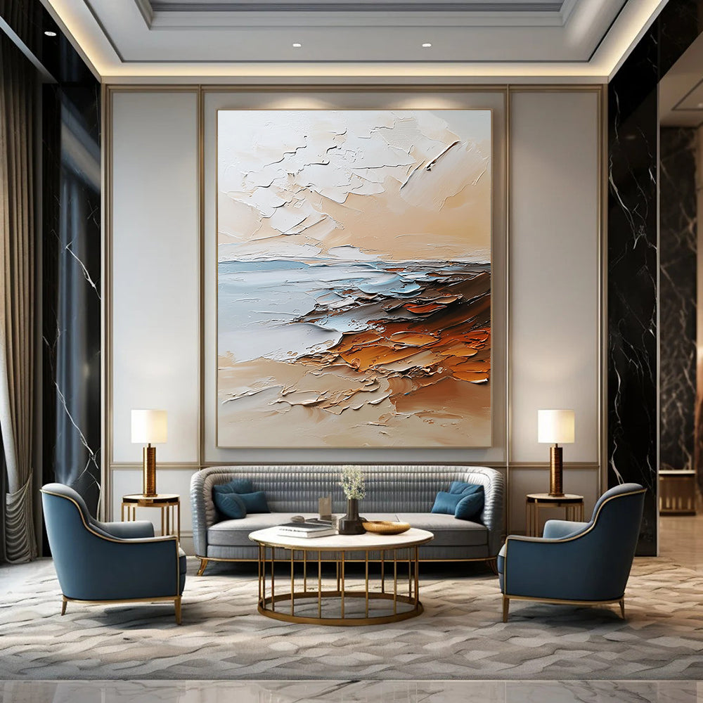 Large abstract painting in beige and white tones featuring textured brushstrokes with light orange brown and gray colors and soft edges.STSC096