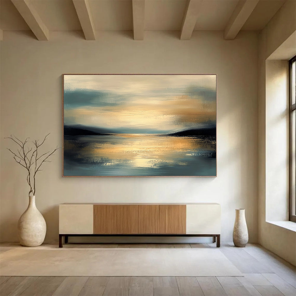 Large abstract painting featuring muted colors and calm water reflecting a detailed sky during golden hour with a serene atmosphere and gentle brushwork.SC064