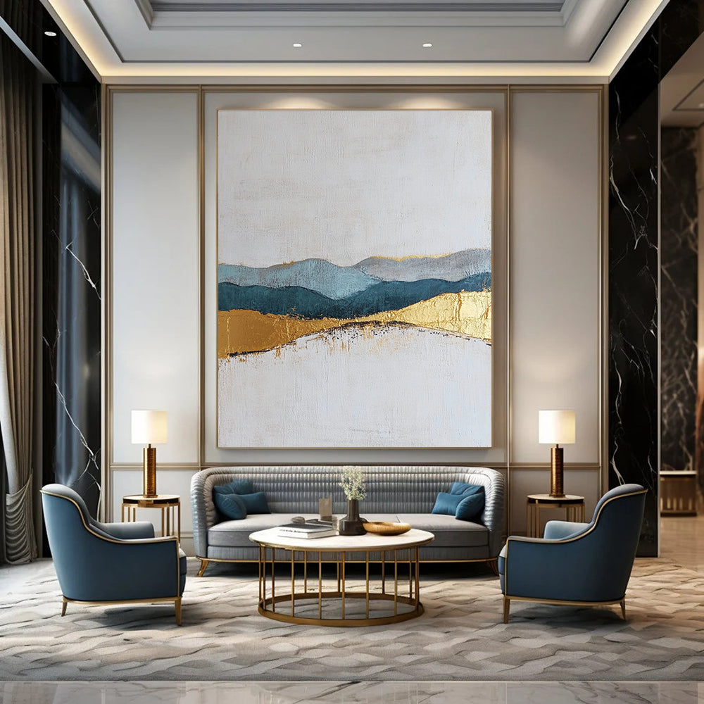Large abstract painting featuring textured layers in neutral colors with elegant gold and blue accents for a sophisticated decor.STSC110