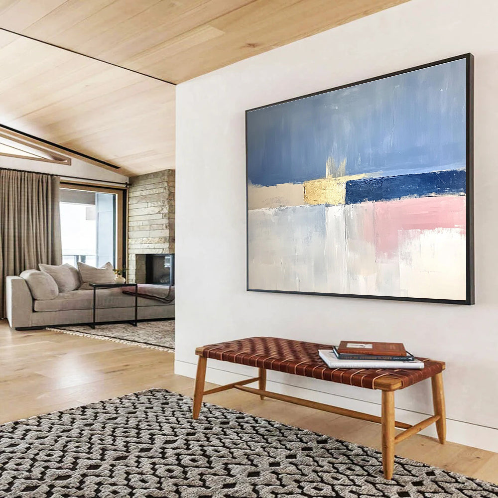 Large abstract painting featuring soft blue skies, pale pink horizons, gold highlights, and a tranquil sea in muted tones.SC025