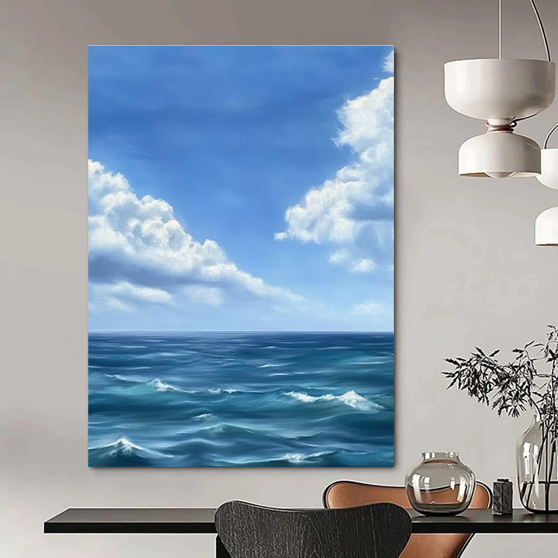 Large abstract painting depicting a tranquil ocean scene with gentle waves under a vast blue sky and soft white clouds in Monet's style.STSC1215