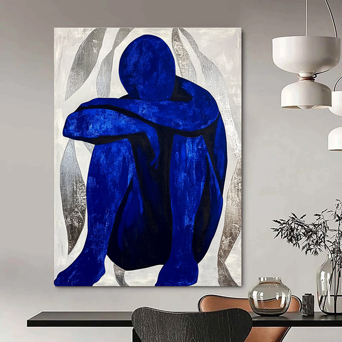 Large abstract painting featuring a contemplative blue figure amidst silver swirls, evoking tranquility and focus in a minimalist style.STSC922