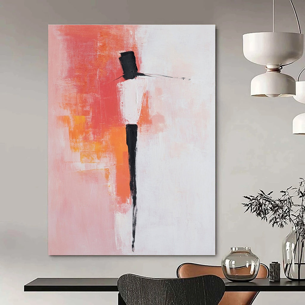 Large abstract painting with pink and white background featuring bold brush strokes simple shapes and peachy red accents with black dress shoes.STSC404