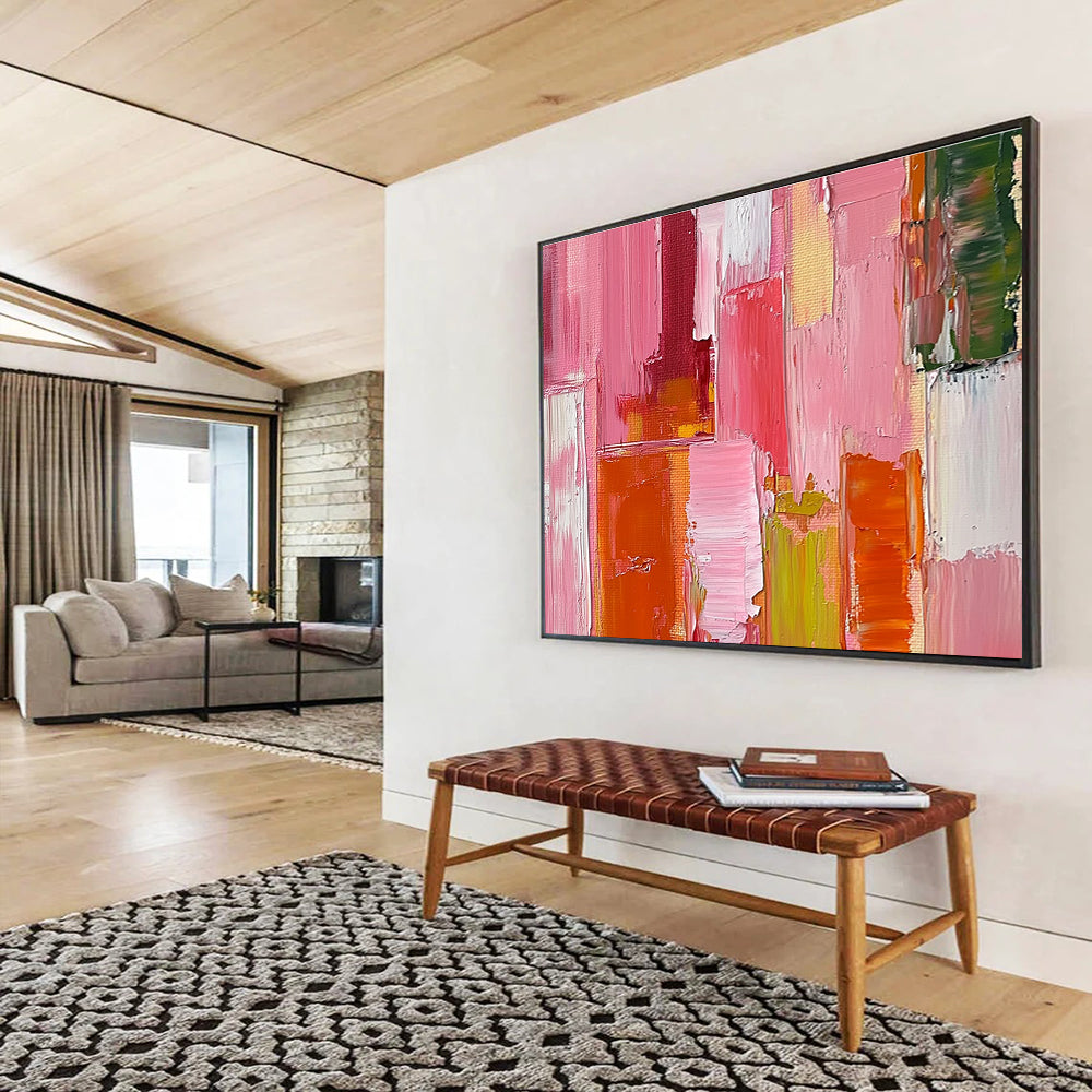 Large abstract oil painting featuring a pink orange and red cityscape with thick brush strokes and a soft impressionist style.SC118