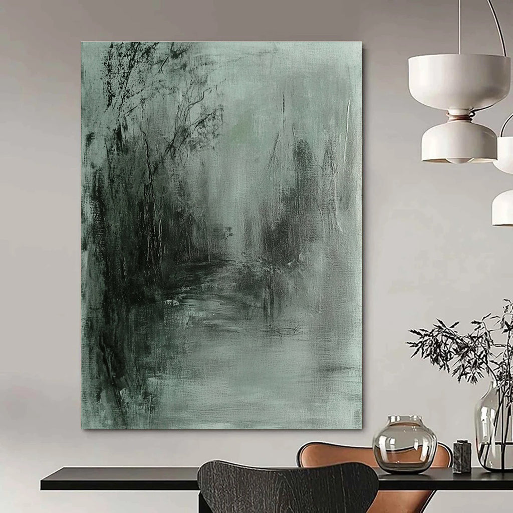 Large abstract painting in gray and green tones featuring soft edges and a dark background evokes tranquility and mystery through fluid brushstrokes.STSC419