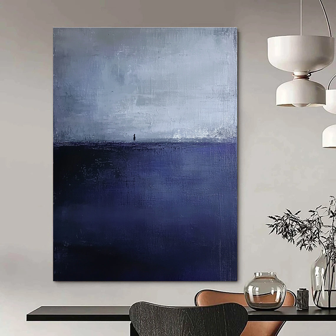 Large abstract painting in dark blue and gray depicting an atmospheric seascape with a small silhouette on the distant horizon.STSC1085