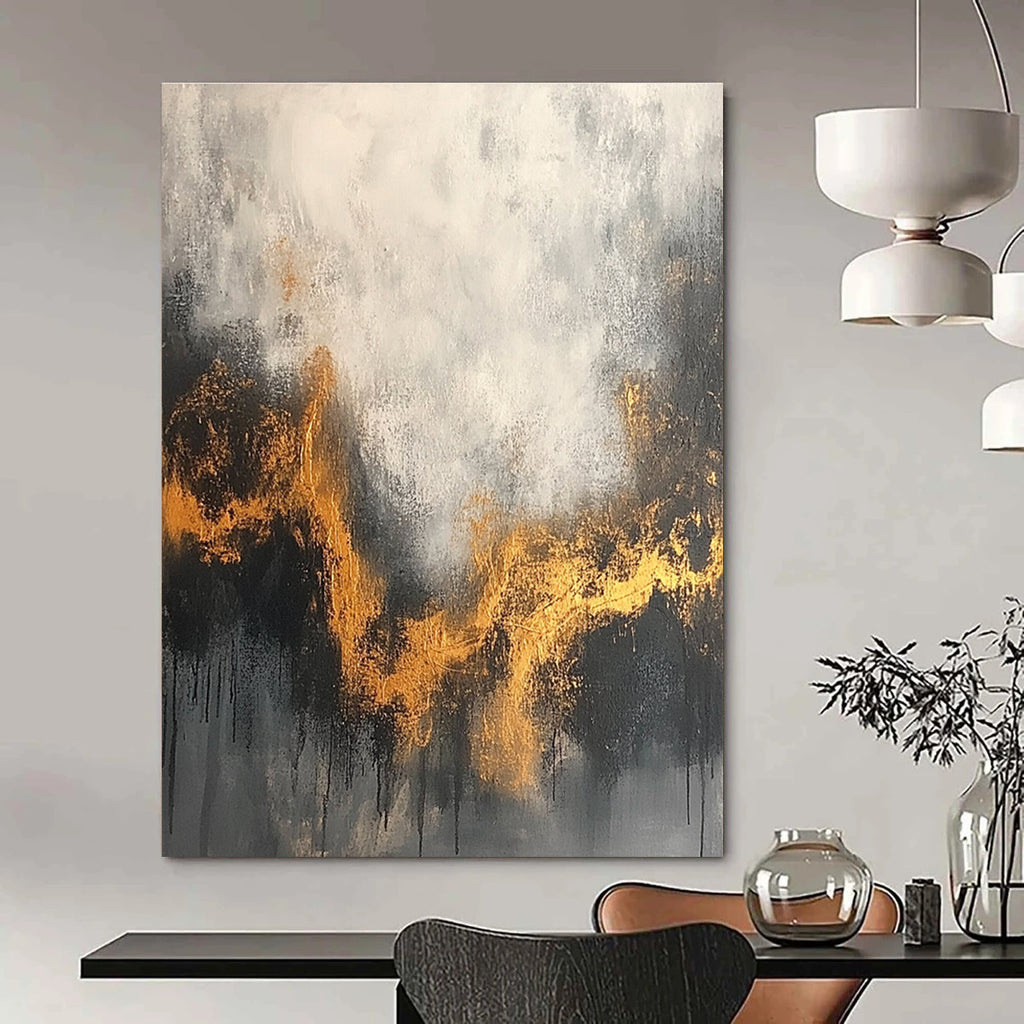 Large abstract painting with a gray and white background accentuated by gold tones and dark colors for an atmospheric effect.STSC394