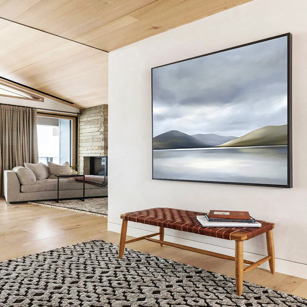 Large abstract painting of the Scottish Highlands featuring muted colors soft light grey sky white clouds and a serene lake in the foreground.SC131