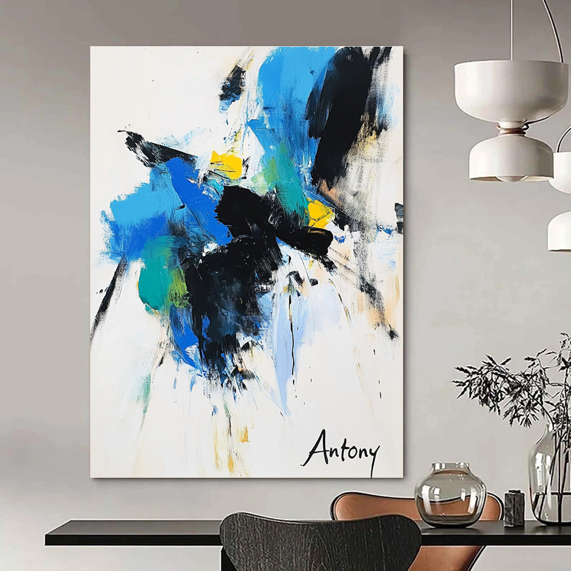 Abstract painting features bold black brush strokes with blue green and yellow accents on a white background with Antony elegantly displayed in large letters.STSC039