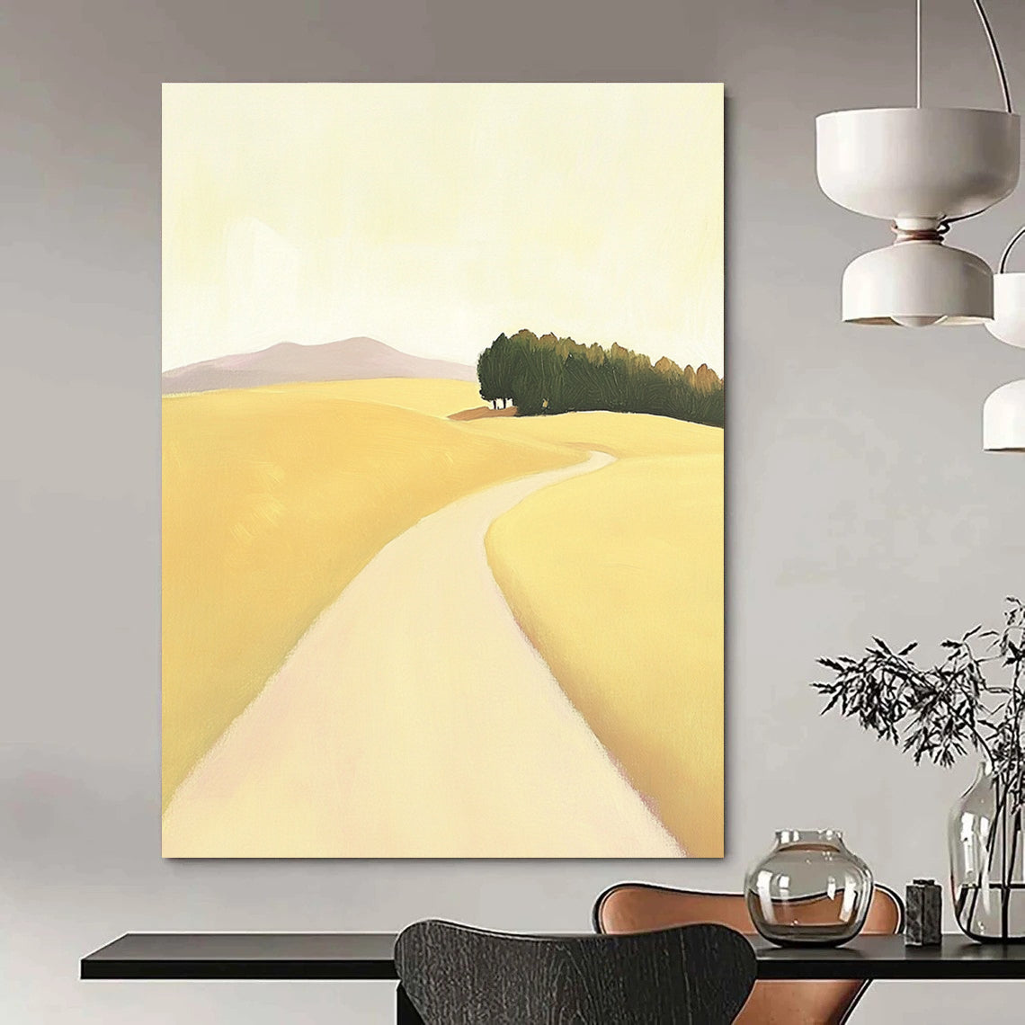 A large abstract painting depicting a minimalist road in an open field with hills and trees in soft yellow beige and green tones.STSC1167