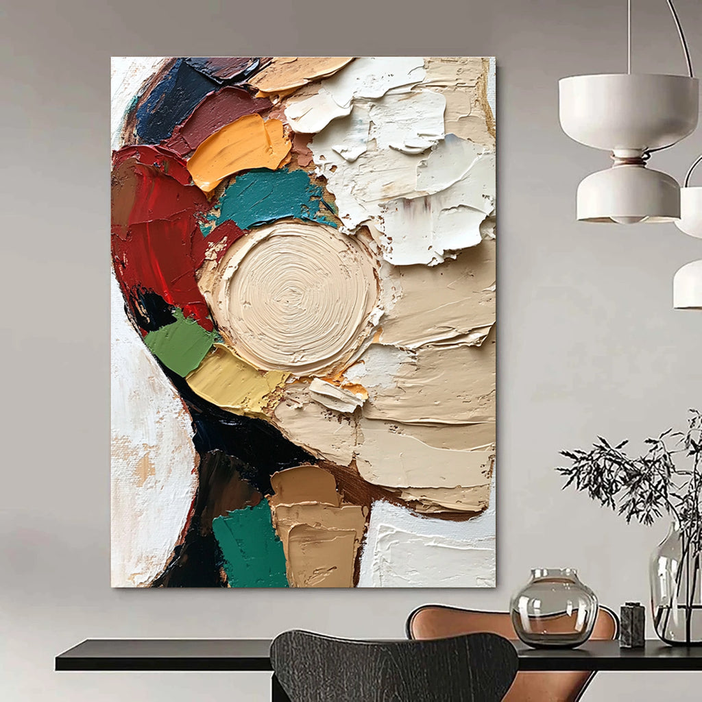 Large abstract painting featuring a textured close-up of a face in vibrant colors and dynamic brush strokes against a white circular patterned background.STSC283