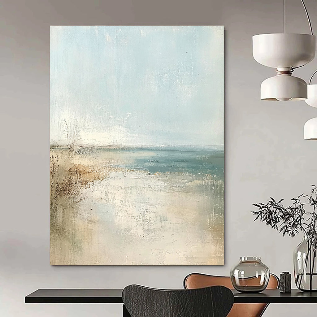 Large abstract painting of a beach in soft pastel colors featuring a light blue sky and neutral tones for a serene atmosphere.STSC158