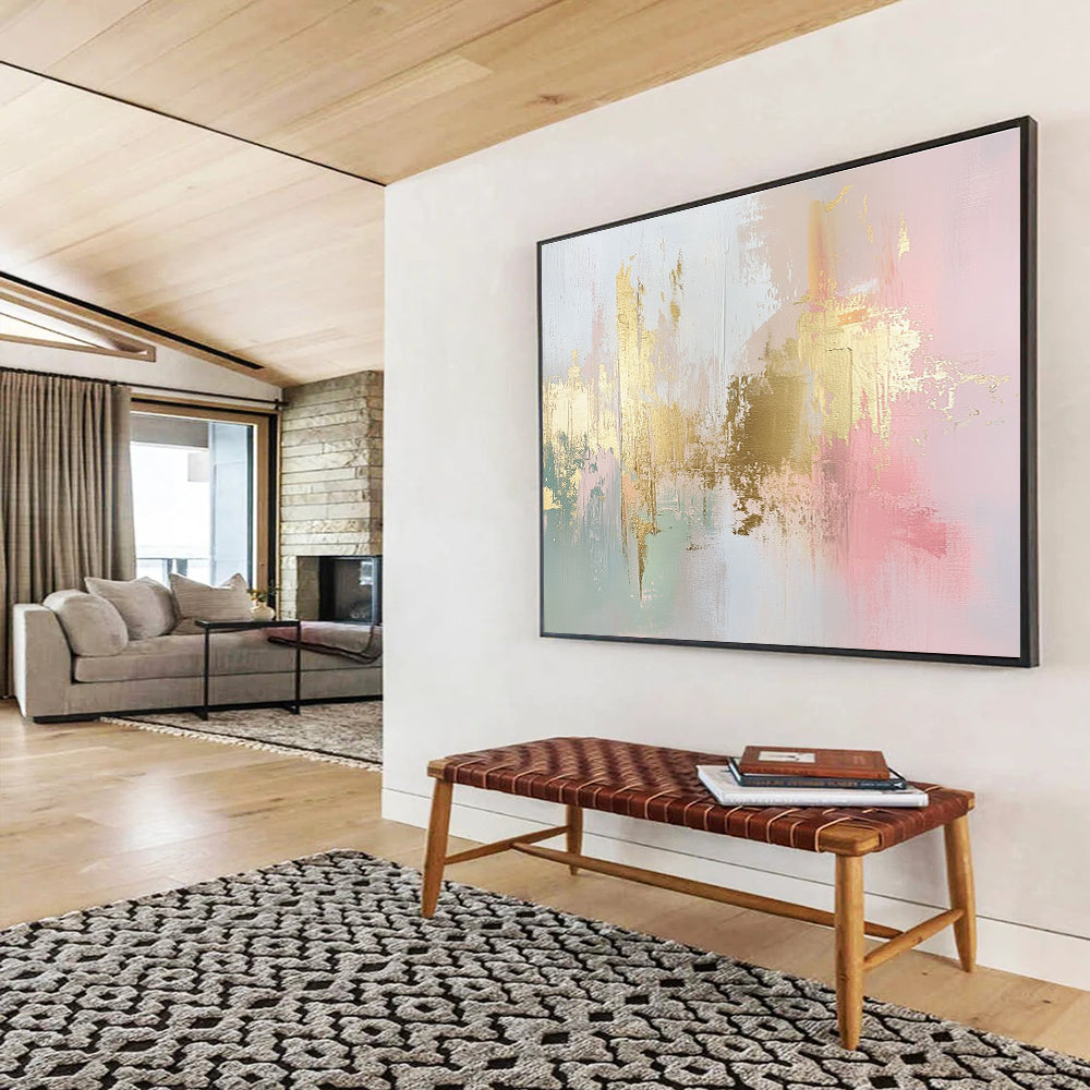 Large abstract painting in soft pink, white, and gold with hints of light green and neutral tones, featuring dynamic brush strokes and a modern art style.SC283