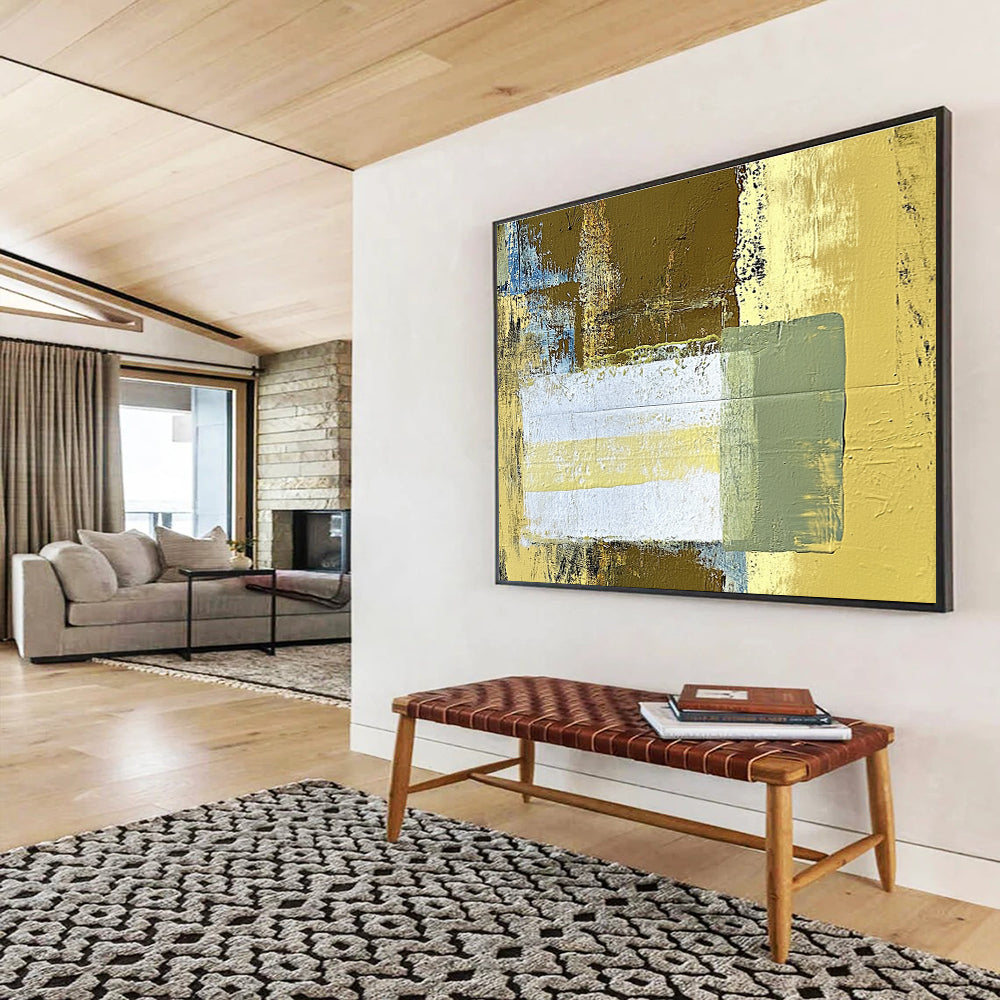 Large abstract painting featuring beige and yellow tones with a central white rectangle and green stripe against a dark brown background.SC425