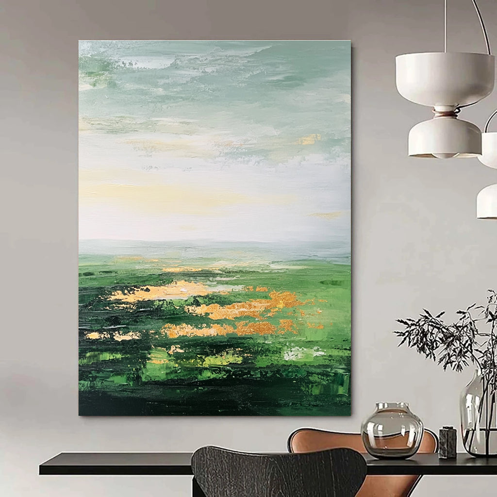 Large abstract painting featuring a vast green landscape soft sky gold accents and thick brush strokes for a dreamy blurry effect.STSC887