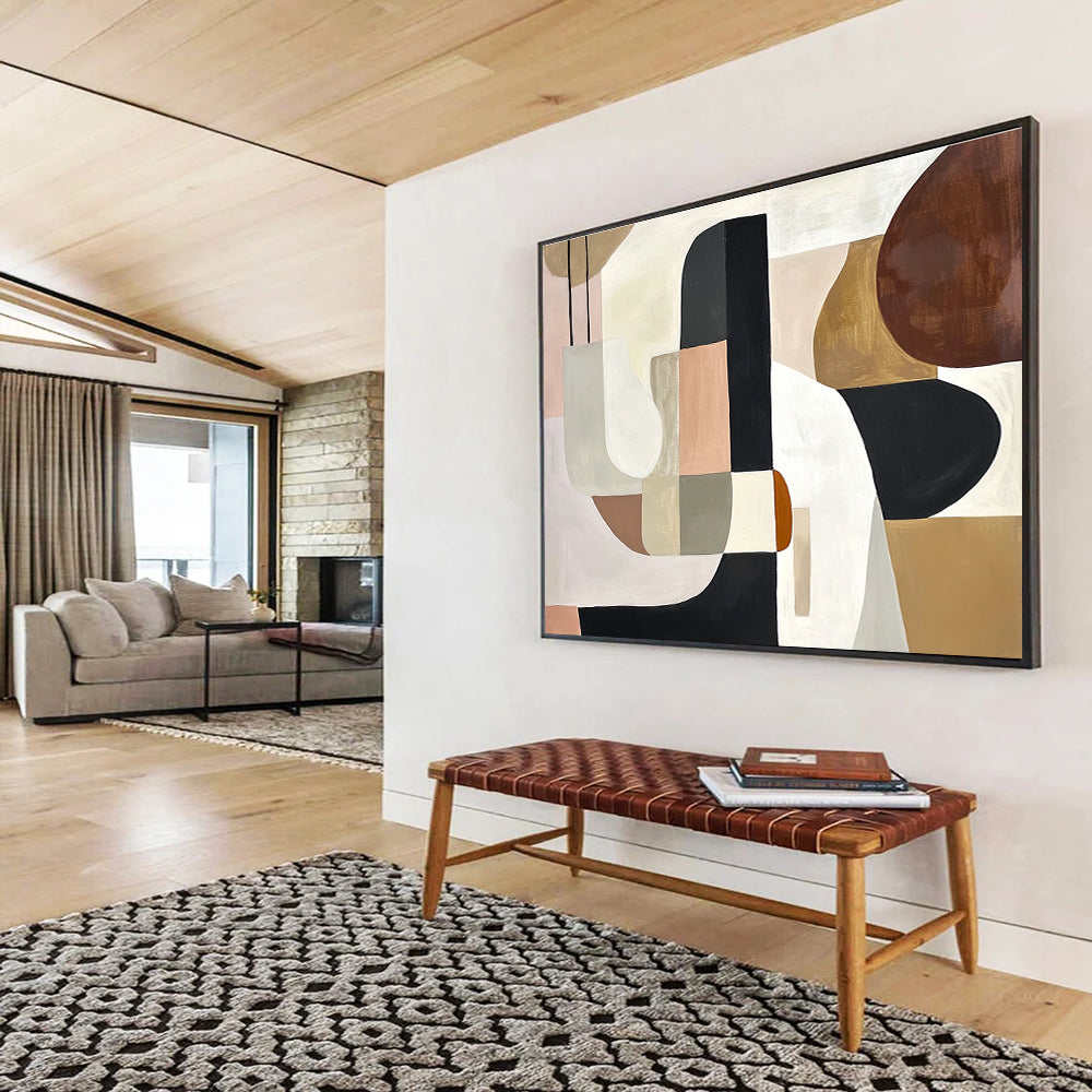 An abstract painting featuring elegant shapes in white, black, and brown, accented with soft beige, pink, grey, and cream tones and brown wood elements.SC352
