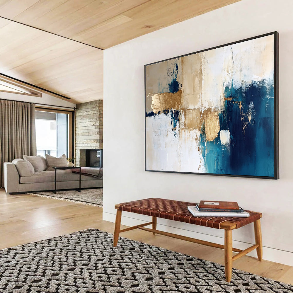 Large abstract painting in blue and gold with white beige and cream tones ideal for modern decor and artistic spaces.SC024