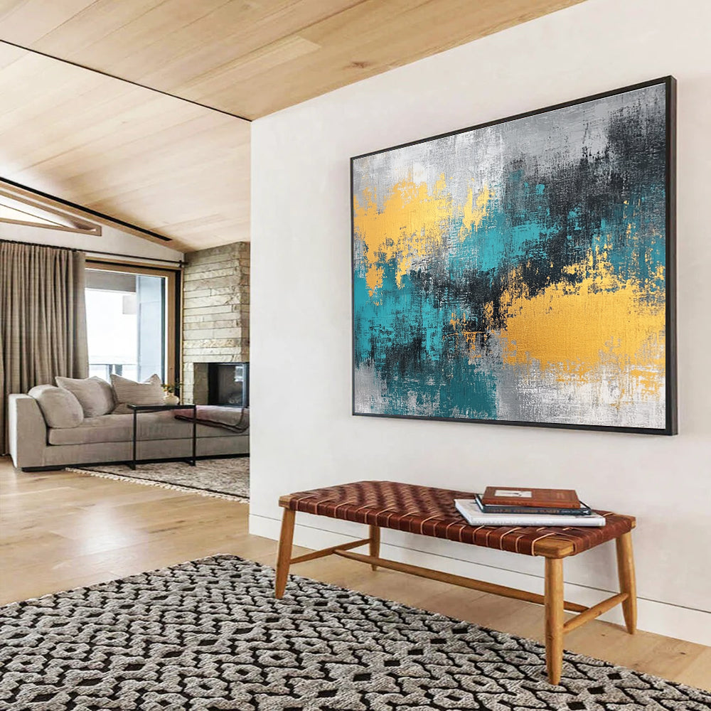 Large abstract painting featuring teal, grey, and gold hues that add a vibrant touch to any space.SC260