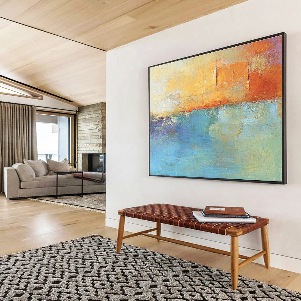 Large abstract oil painting in muted orange and aqua with soft shapes and blurred edges evoking calmness and tranquility through its impressionist style.SC124