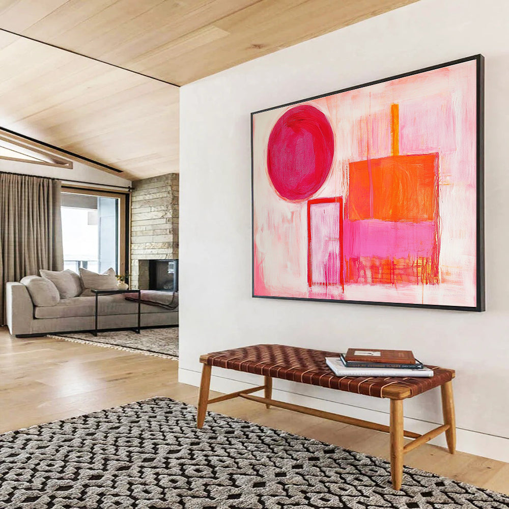 The large abstract painting features thick brush strokes with warm pink and orange hues, showcasing a circle, square, and rectangular shape.SC540