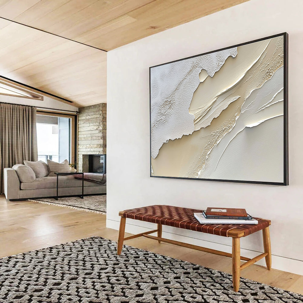 An abstract painting featuring a textured cream-colored surface reminiscent of sand dunes in soft white and beige tones.SC459